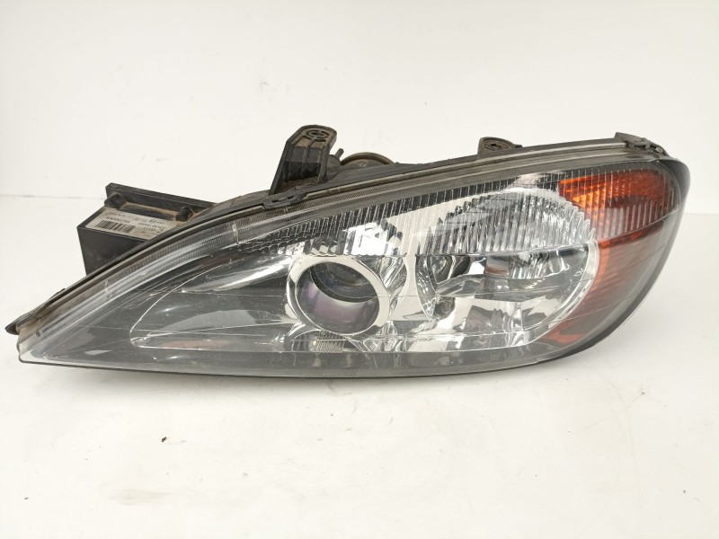 Recambio de faro izquierdo para nissan primera 1.6 g referencia OEM IAM 89006288  