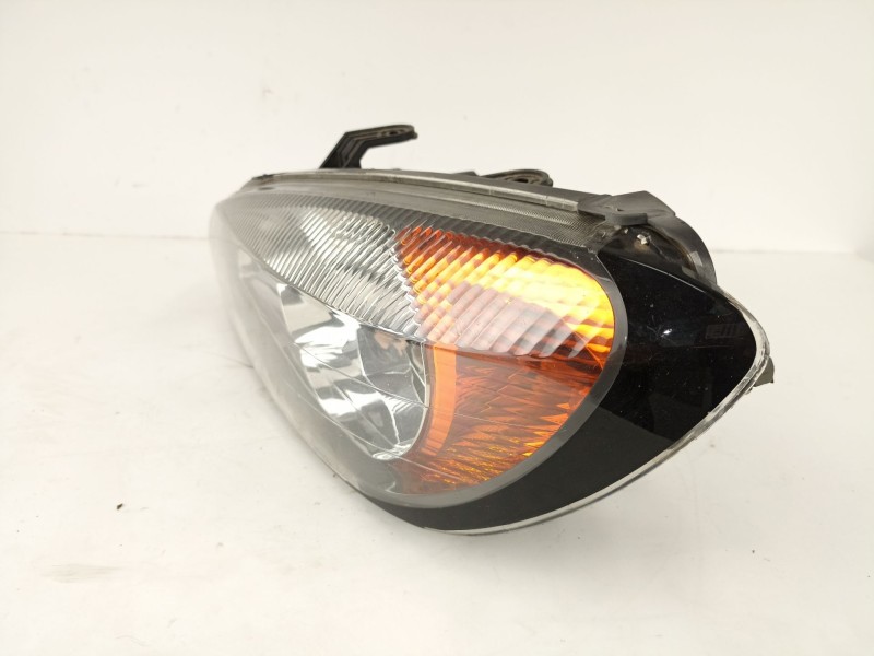 Recambio de faro izquierdo para nissan primera 1.6 g referencia OEM IAM 89006288  