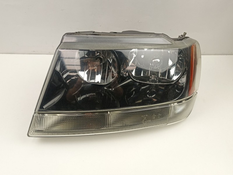 Recambio de faro izquierdo para jeep gr.cherokee (wj/wg) 3.1 td cat referencia OEM IAM 55155145  