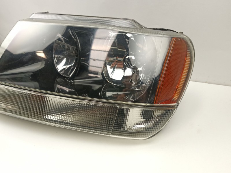 Recambio de faro izquierdo para jeep gr.cherokee (wj/wg) 3.1 td cat referencia OEM IAM 55155145  