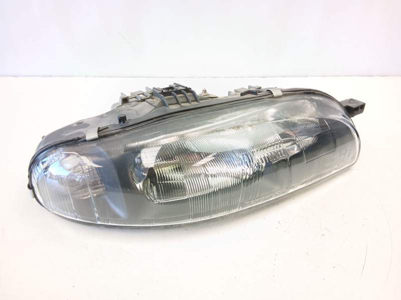 Recambio de faro derecho para fiat bravo i (182_) 1.9 jtd referencia OEM IAM 46523122  