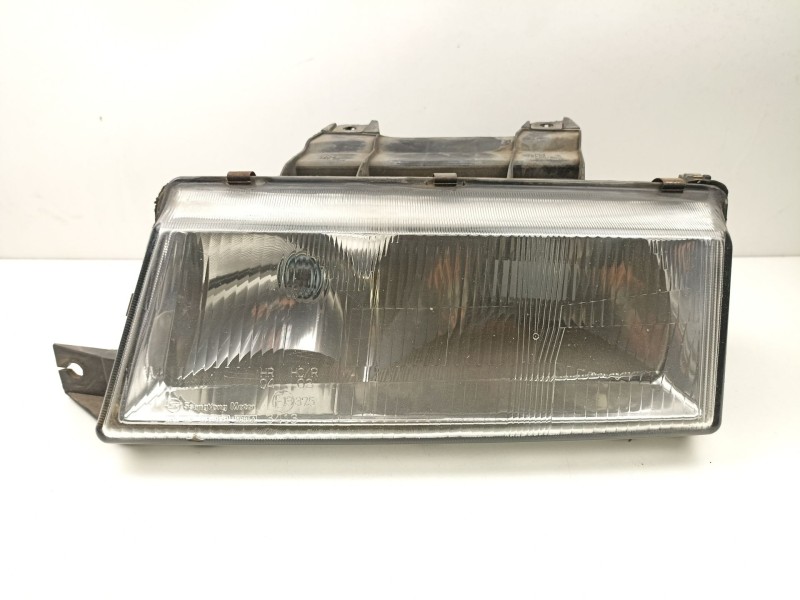 Recambio de faro izquierdo para ssangyong musso 2.9 td /om662 referencia OEM IAM 8310105100X  