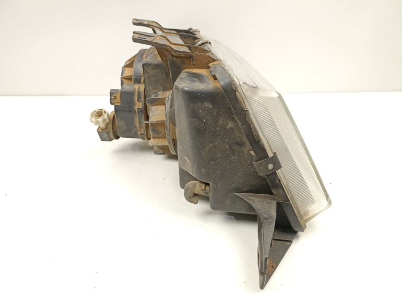 Recambio de faro izquierdo para ssangyong musso (fj) 2.9 td referencia OEM IAM 8310105100X  