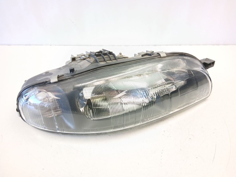 Recambio de faro derecho para fiat bravo i (182_) 1.9 jtd referencia OEM IAM 46523122  